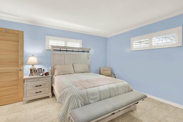 bedroom with baseboards and ornamental molding