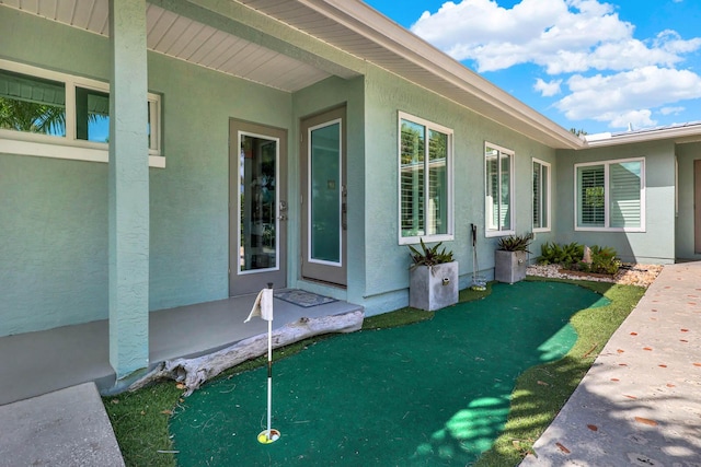 view of side of home featuring stucco siding