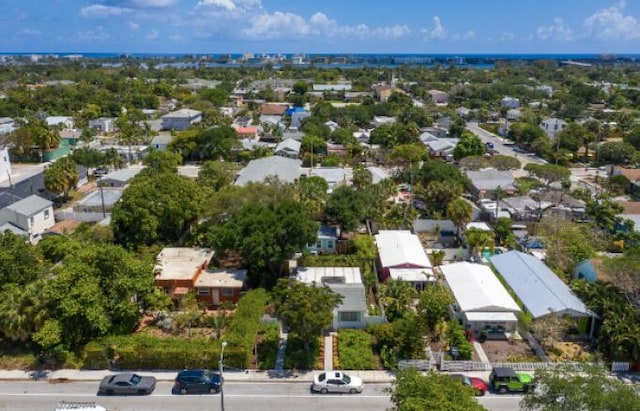 birds eye view of property with a residential view