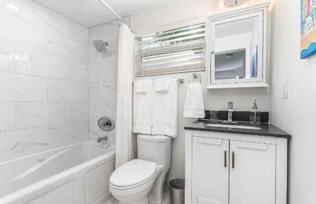 bathroom featuring shower / tub combo with curtain, vanity, and toilet