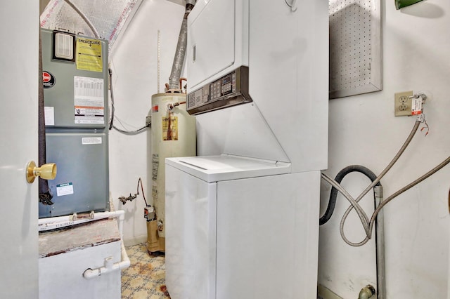 washroom featuring laundry area, water heater, heating unit, light floors, and stacked washer and clothes dryer