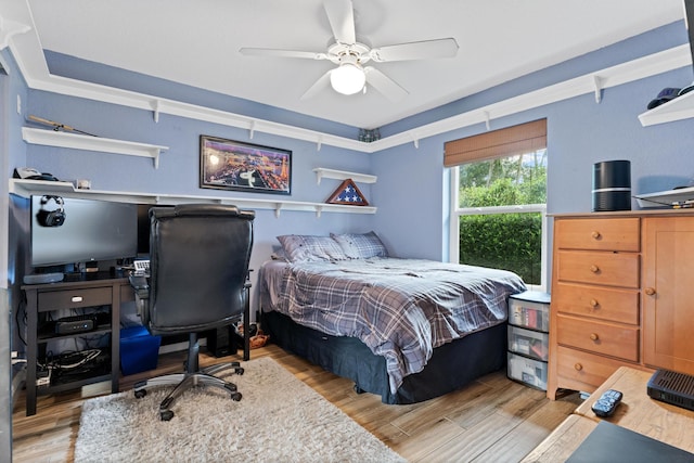 bedroom with light wood-style floors and ceiling fan