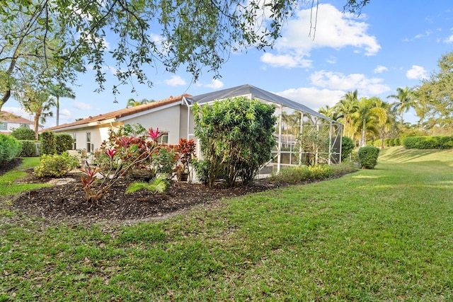 view of yard featuring a lanai