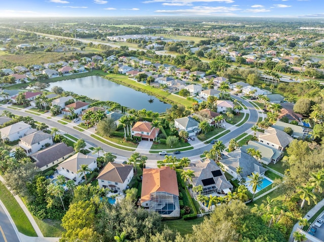 aerial view with a water view and a residential view