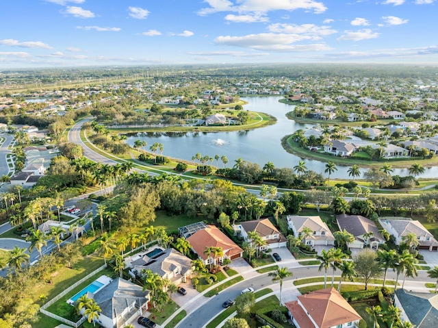 drone / aerial view with a residential view and a water view