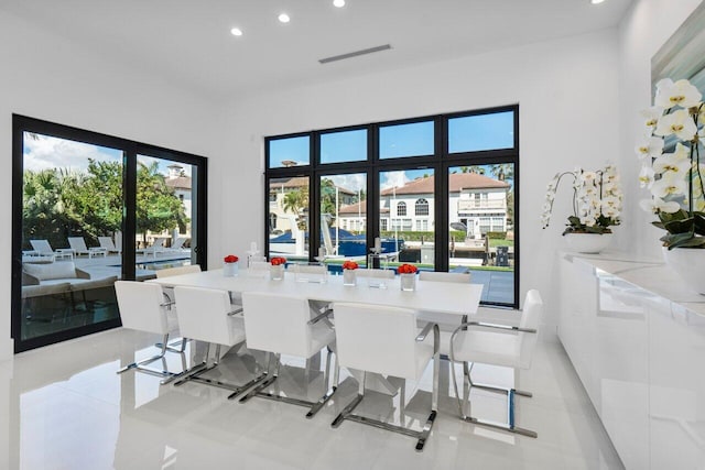 dining space featuring recessed lighting, visible vents, and light tile patterned floors