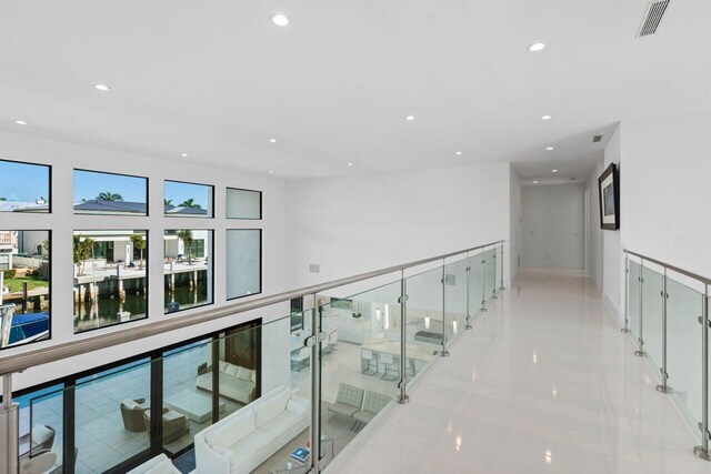 foyer featuring stairs and baseboards