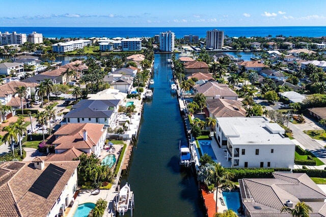 birds eye view of property featuring a water view and a residential view