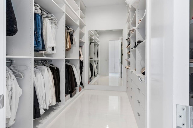 spacious closet with tile patterned floors