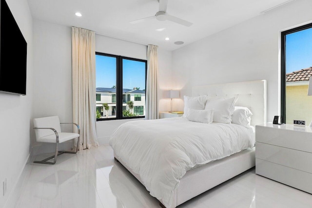 bedroom with a ceiling fan, recessed lighting, and baseboards