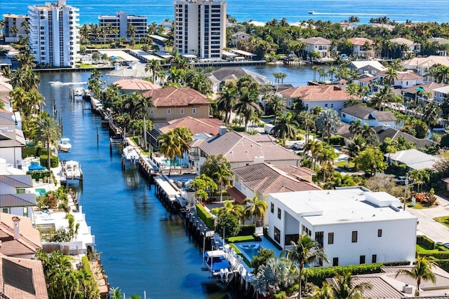 drone / aerial view with a water view and a residential view