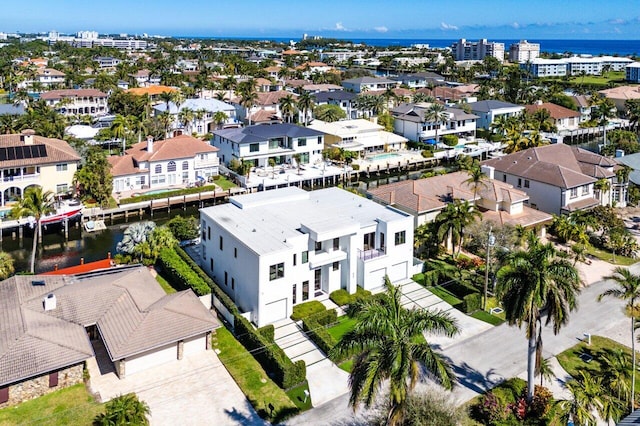 bird's eye view featuring a residential view and a water view