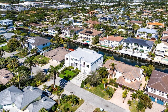 birds eye view of property featuring a water view and a residential view