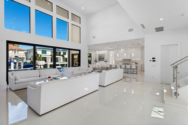 living area with visible vents and recessed lighting