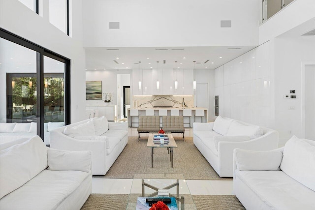 living room with a high ceiling