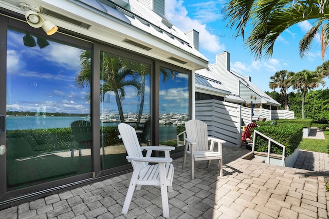 view of patio / terrace with a water view