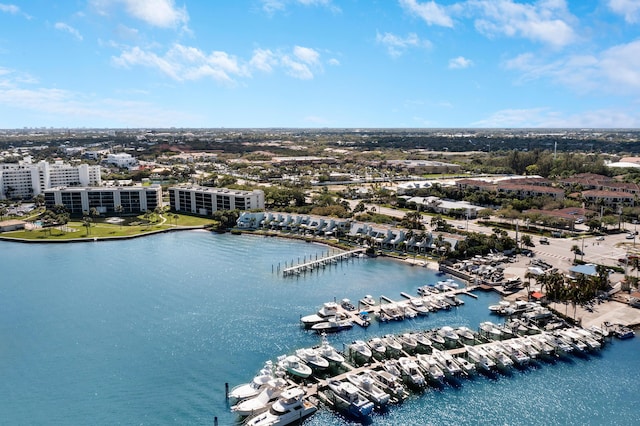 drone / aerial view featuring a view of city and a water view