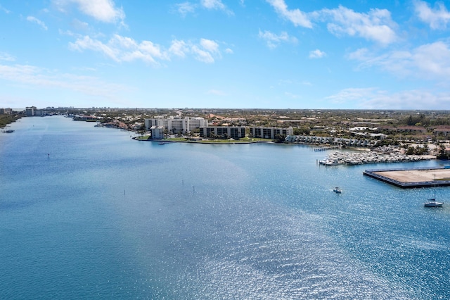 view of water feature featuring a view of city and a dock