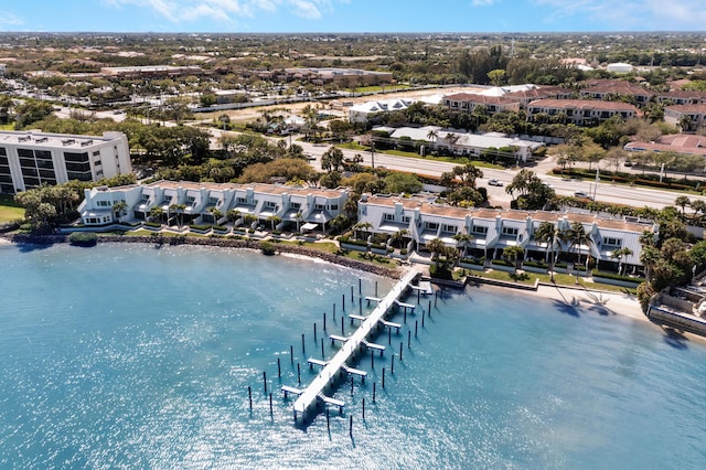 bird's eye view featuring a water view and a residential view