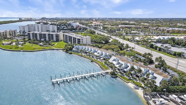 drone / aerial view featuring a water view and a view of city