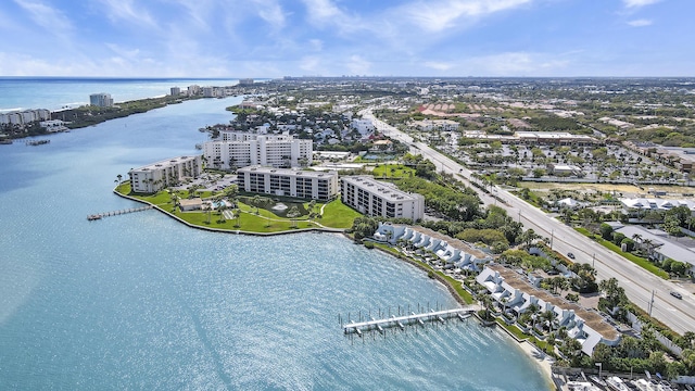 bird's eye view featuring a water view and a city view