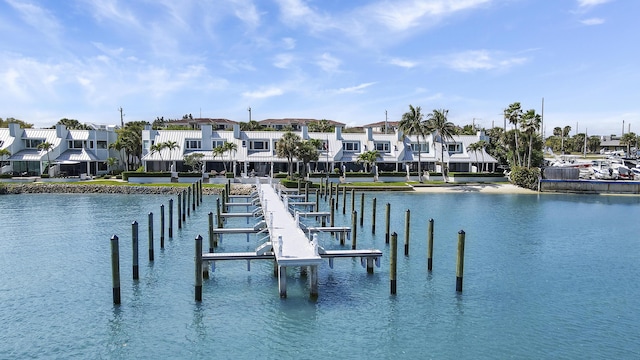 view of dock featuring a residential view and a water view