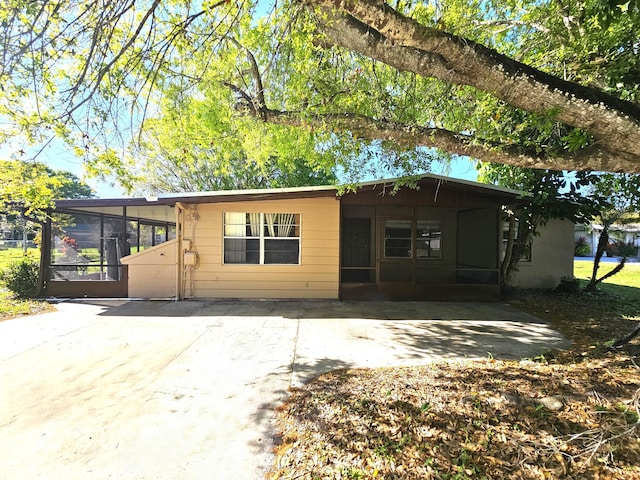 view of front of home featuring a sunroom