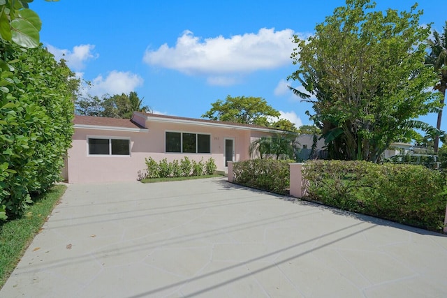 ranch-style home with stucco siding