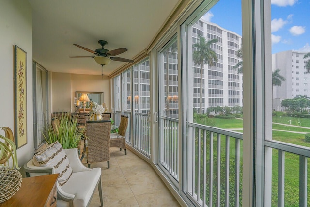 balcony featuring a view of city and ceiling fan