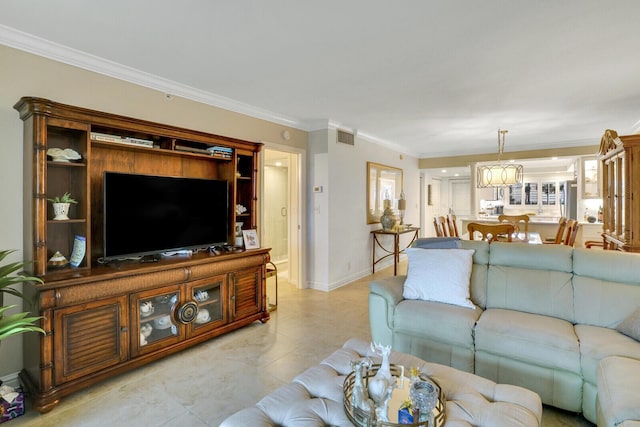 living room featuring baseboards, visible vents, and ornamental molding