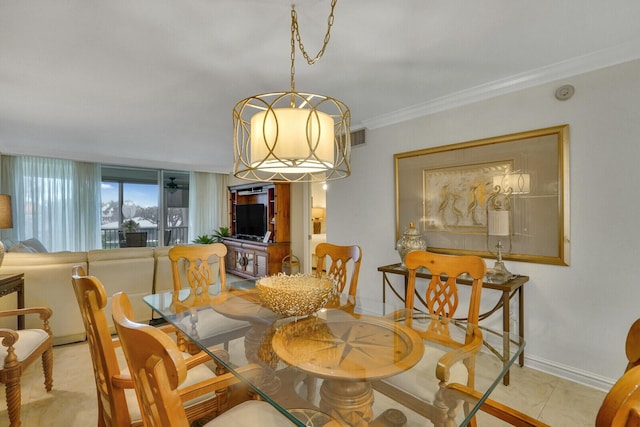 dining space featuring light tile patterned floors, baseboards, visible vents, ornamental molding, and a chandelier