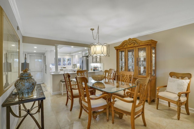 dining room with ornamental molding, baseboards, and light tile patterned floors