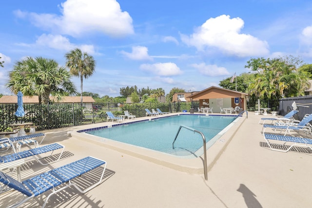 pool featuring a patio and fence