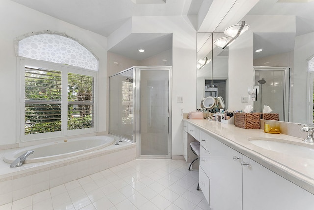 full bathroom with a stall shower, tile patterned floors, vanity, and a bath