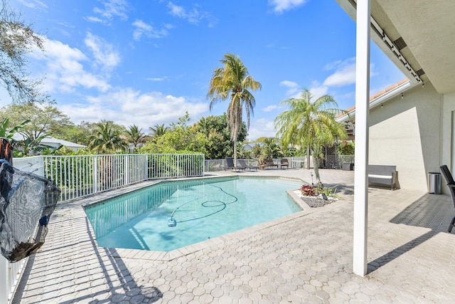 view of swimming pool with a fenced in pool, a patio area, and fence