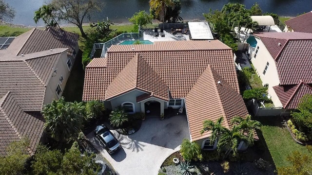 birds eye view of property with a water view