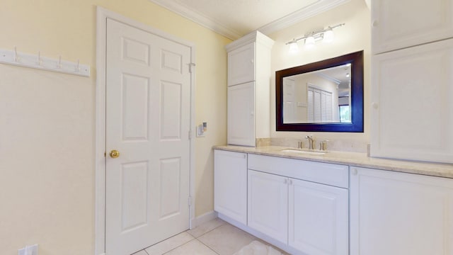 bathroom with vanity, crown molding, and tile patterned floors