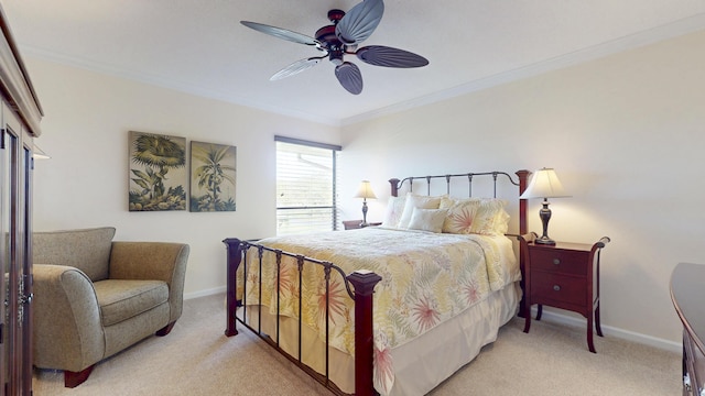 bedroom with light carpet, ceiling fan, baseboards, and crown molding