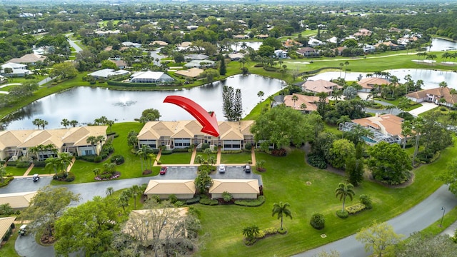 birds eye view of property with a water view, view of golf course, and a residential view