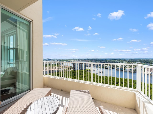 balcony featuring a water view