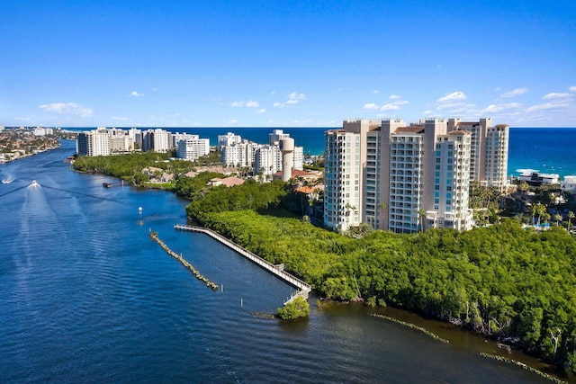 birds eye view of property featuring a view of city and a water view