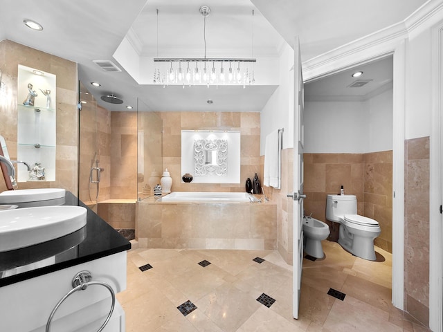 full bathroom with a garden tub, visible vents, tile walls, a bidet, and crown molding