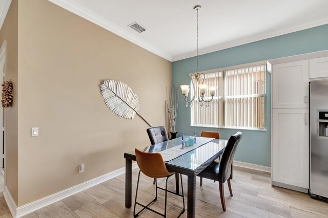 6782 Hillsdale Pt, Boynton Beach, FL 33437 - dining room with light wood finished floors, visible vents, baseboards, ornamental molding, and a chandelier