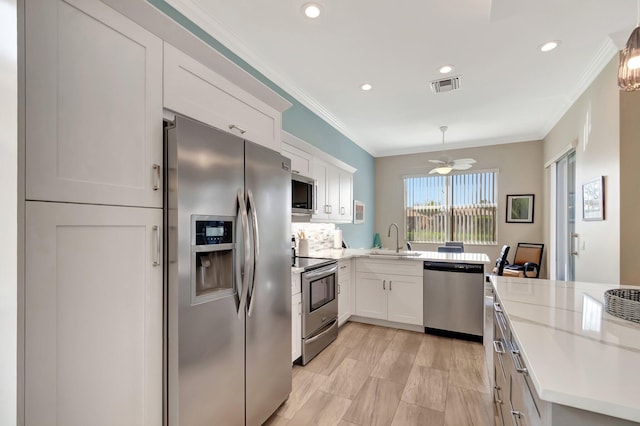 6782 Hillsdale Pt, Boynton Beach, FL 33437 - kitchen featuring pendant lighting, visible vents, appliances with stainless steel finishes, white cabinetry, and a sink