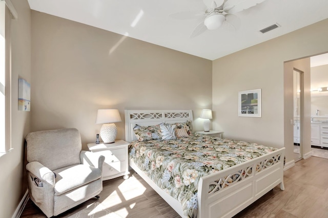 6782 Hillsdale Pt, Boynton Beach, FL 33437 - bedroom with visible vents, ensuite bathroom, baseboards, and wood finished floors