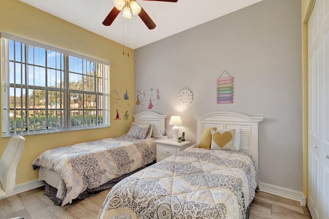 6782 Hillsdale Pt, Boynton Beach, FL 33437 - bedroom with light wood-style floors, baseboards, and a ceiling fan
