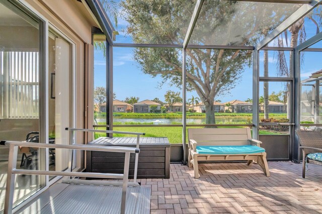 6782 Hillsdale Pt, Boynton Beach, FL 33437 - sunroom / solarium featuring a residential view, a water view, and plenty of natural light