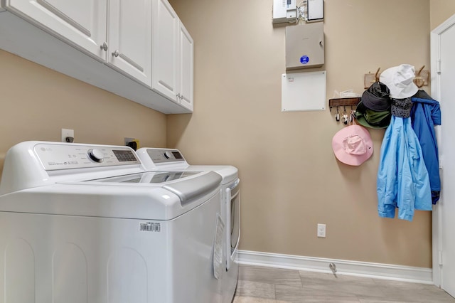 6782 Hillsdale Pt, Boynton Beach, FL 33437 - washroom featuring washing machine and dryer, cabinet space, and baseboards