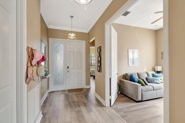 6782 Hillsdale Pt, Boynton Beach, FL 33437 - entryway with ornamental molding, baseboards, visible vents, and light wood finished floors