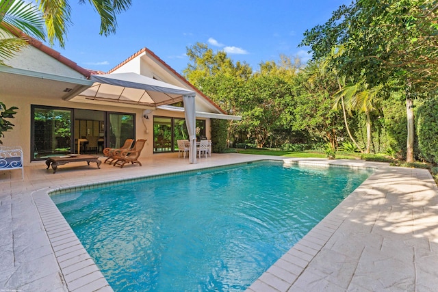 pool with a patio